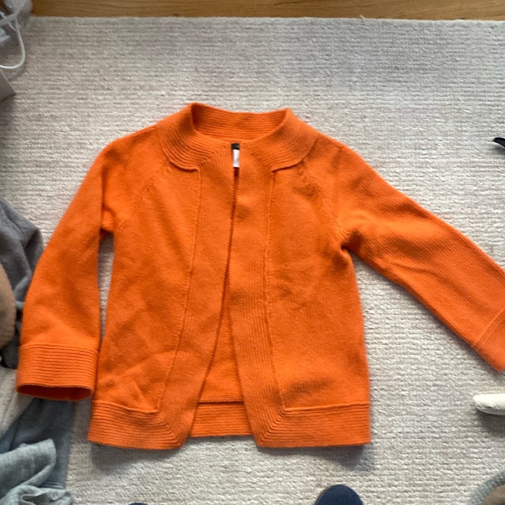 Beautiful orange J Crew cardigan. Nice plush cashmere. Hardly worn.
